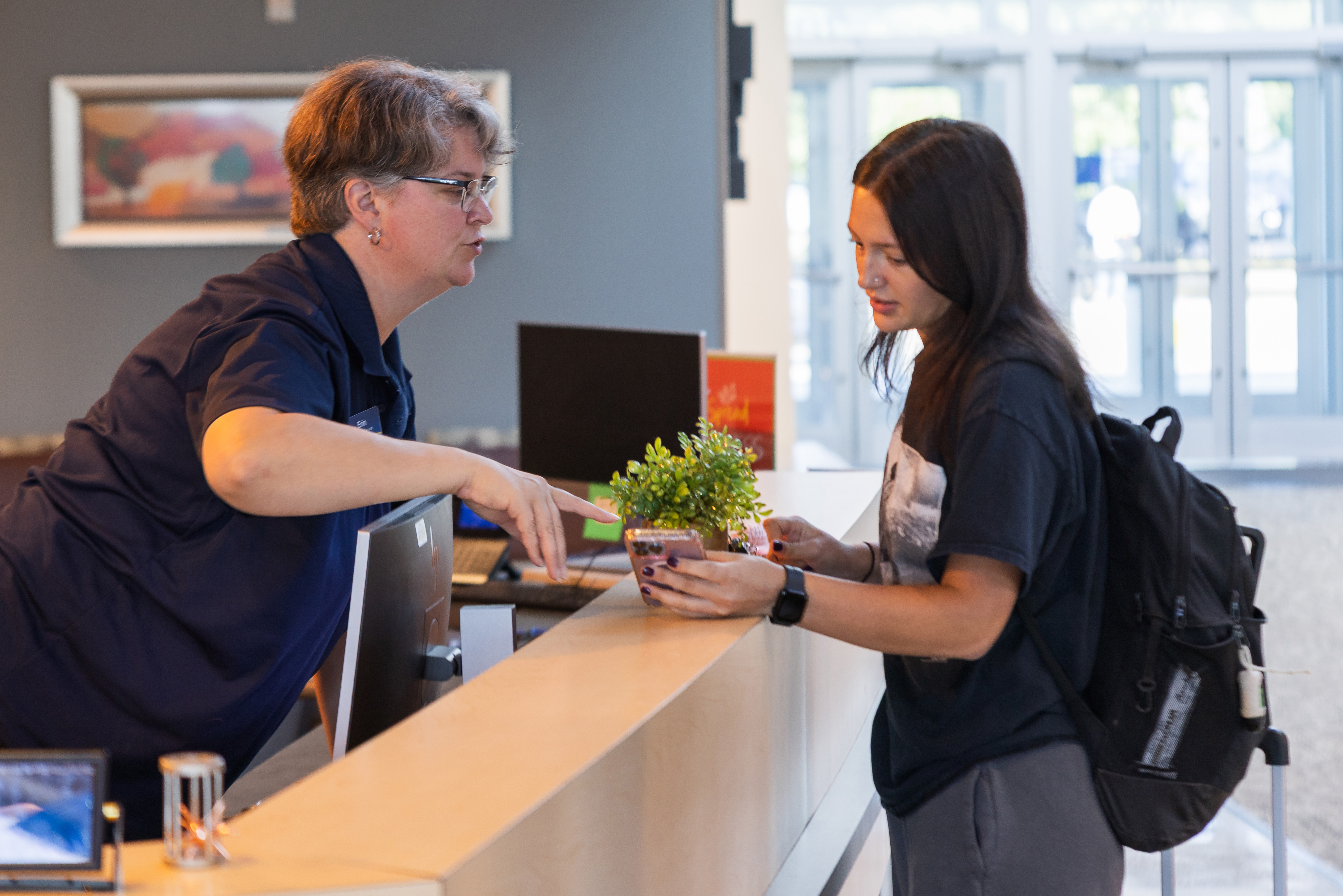 Admissions helping student locate their class